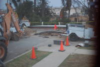 dsc_7060.jpg The gas company digs a big whole in our street to fix the pipes.