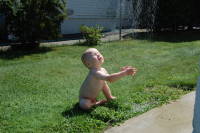 dsc_1256.jpg More than anything, Devin loves taking a shower in the back yard.  He ran over for his turn when he saw the other boys cleaning up after getting back from the beach.