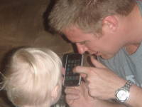 061.JPG Uncle Keith learns not to let Devin too close to an iPhone