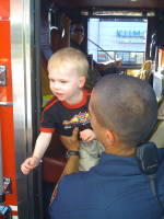 img_0087.jpg Not ready to be a fireman yet, Devin wants right out.