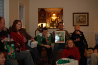 dsc_0322.jpg The group gathers around for a yankee swap with "A Christmas Story" theme